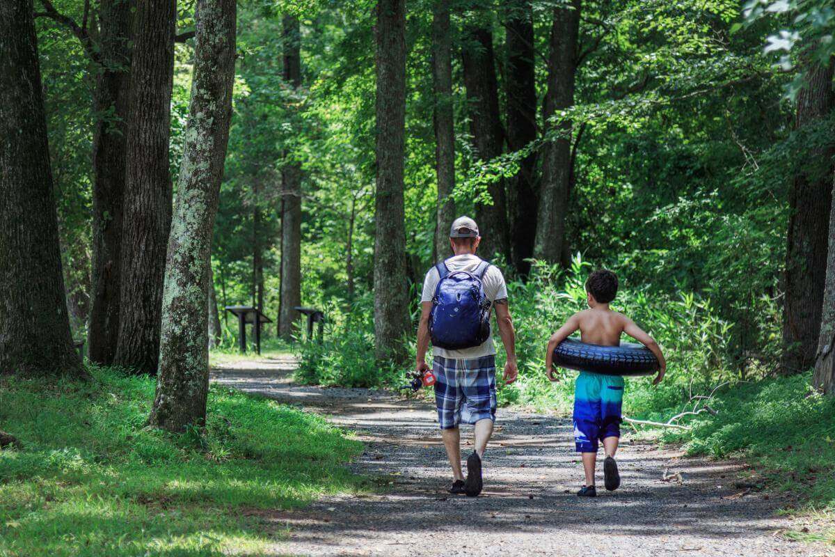 Father and son enjoying the outdoors in Landsford Canal State Park, a peaceful escape near South Carolina’s small towns.